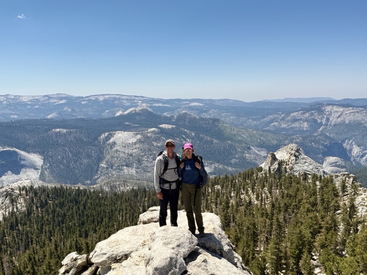 Kevin and Lynlee standing together on Clouds Rest above Yosemite