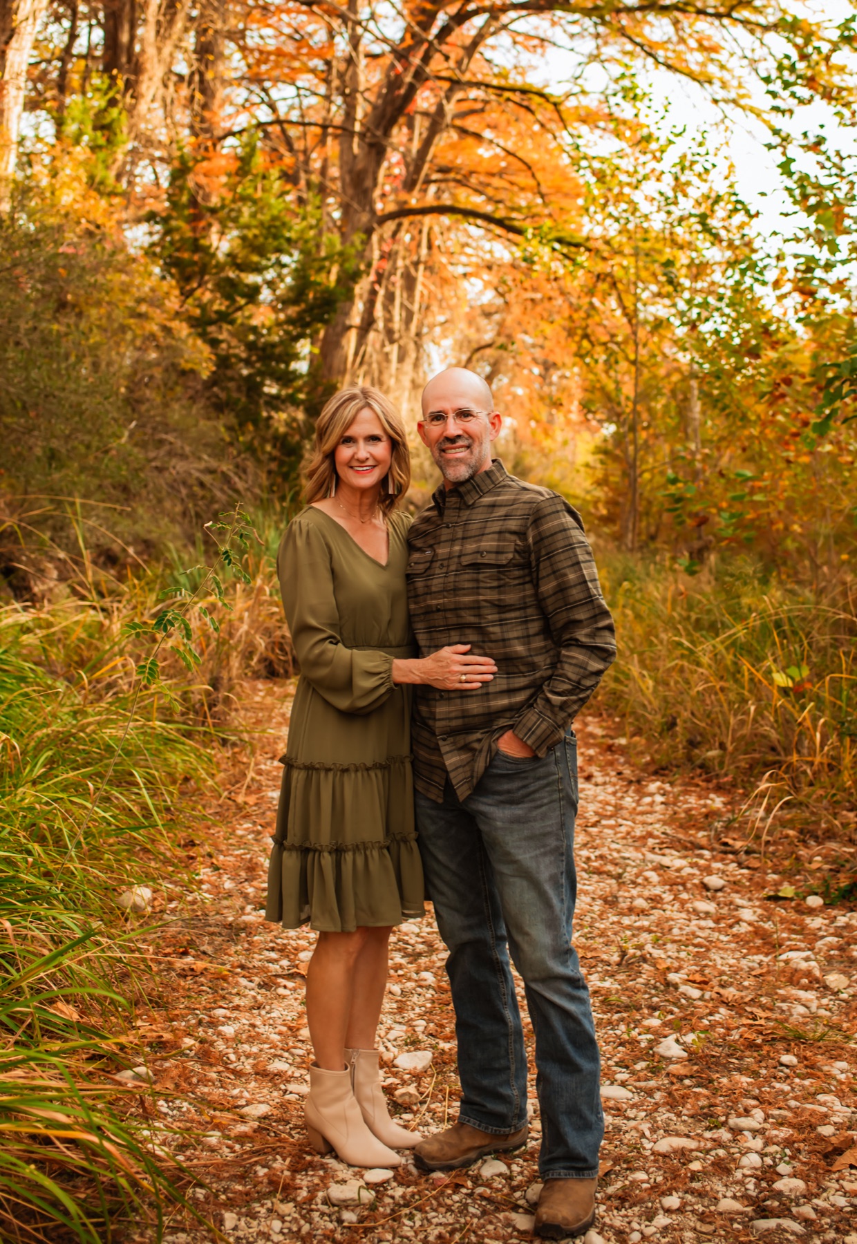 Kevin and Lynlee Ueckert together on a wooded trail